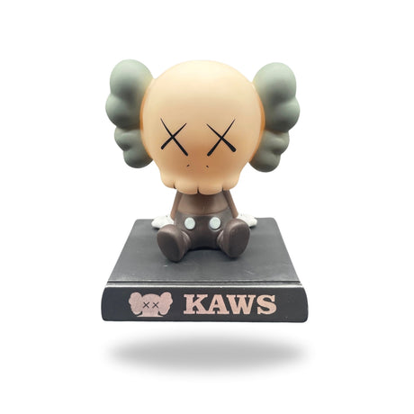 Close-up of White KAWS Bobblehead from Teddy & CoFunland